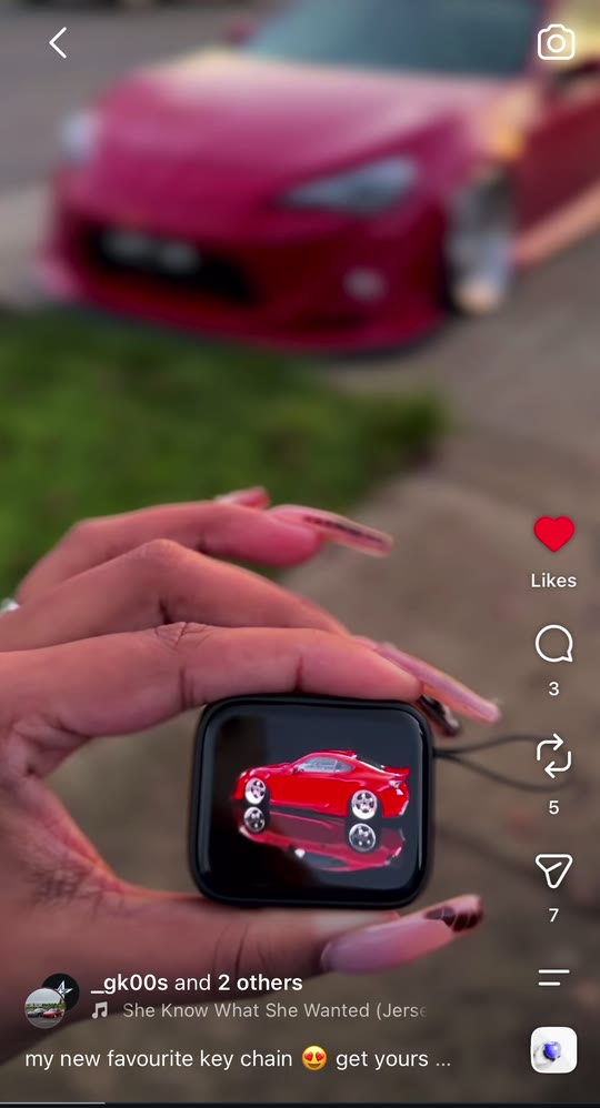 Red coupe miniature on a Keyzovio screen
